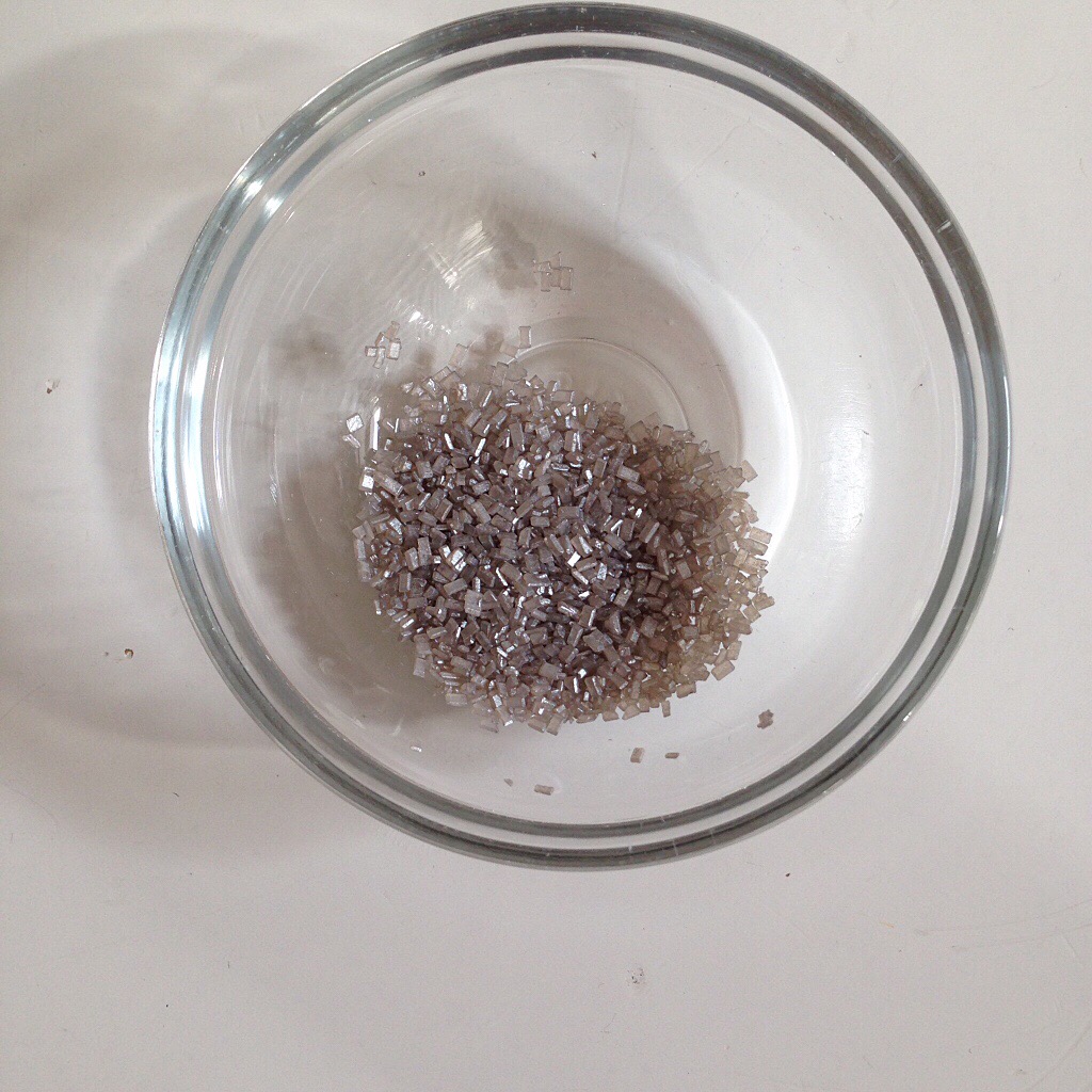 Silver sprinkles in a glass bowl.