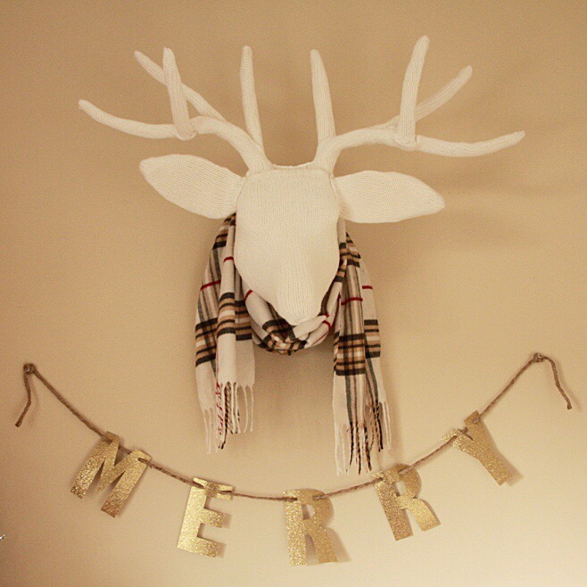 White antlers with a scarf around the head.