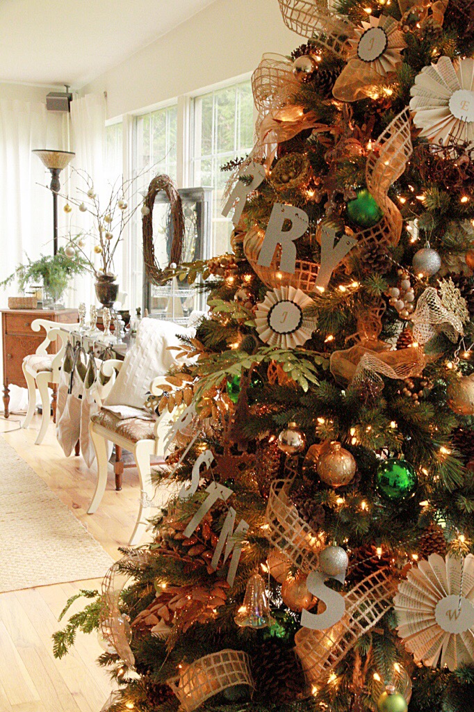 A large decorated Christmas tree by the dining room.