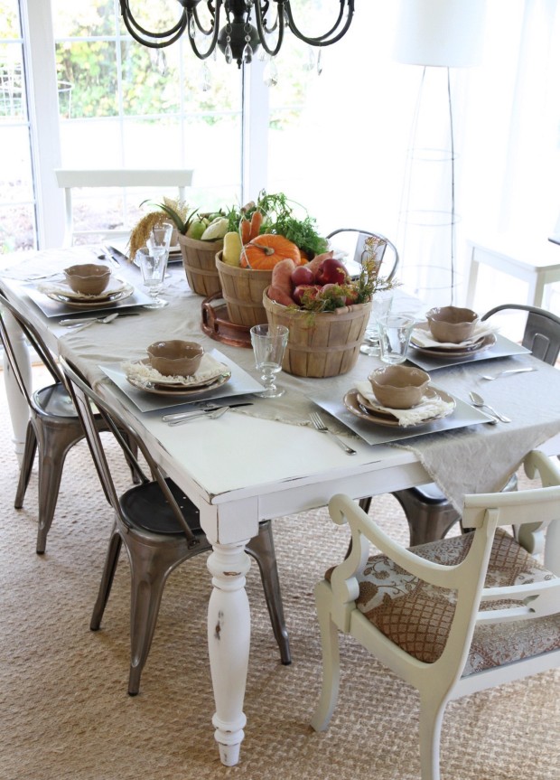 Side view of the table with a chandelier over top of it.