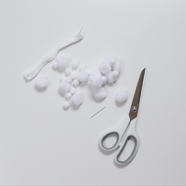 Cotton balls and scissors on the counter.