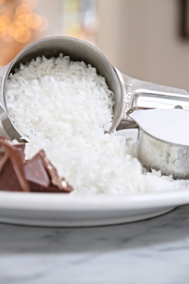 Shredded coconut in a measuring cup.