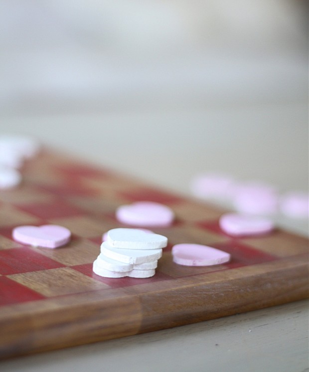 The pink heart checker pieces stacked on top of each other.