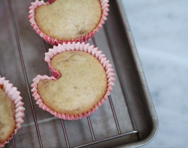 Making a little indent in the muffins that are baked so that they are heart shaped.