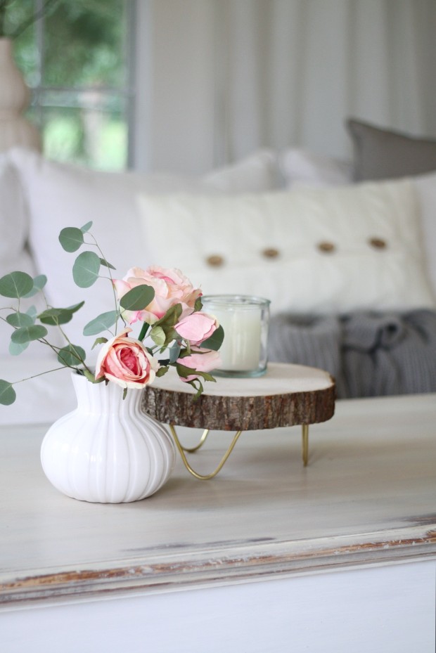 Pink roses beside the round tray.