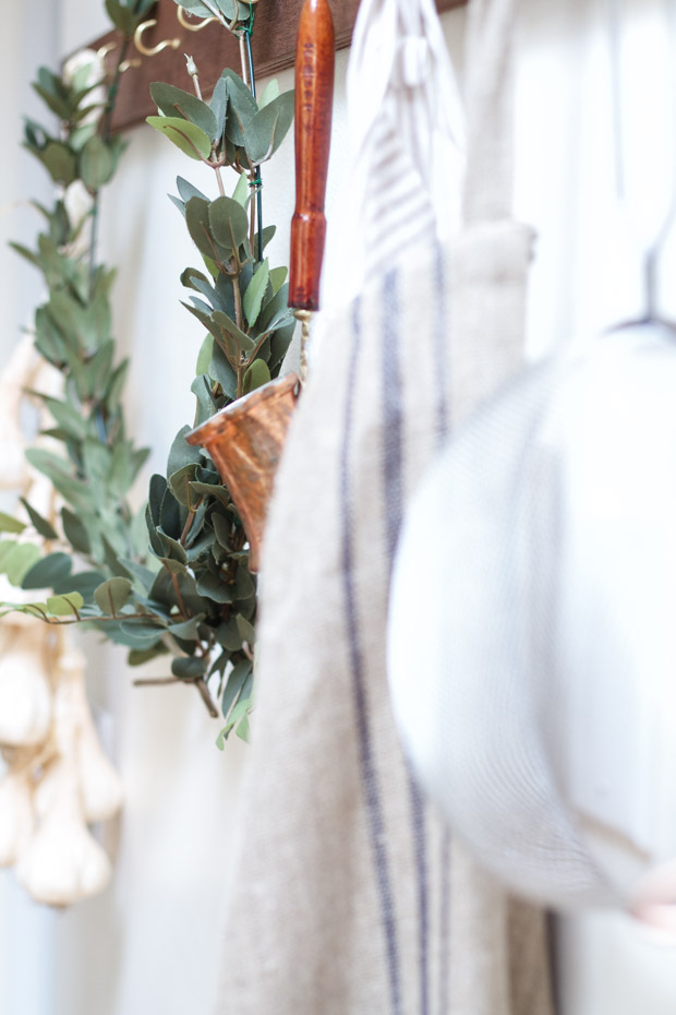 The wire floral wreath hanging up.