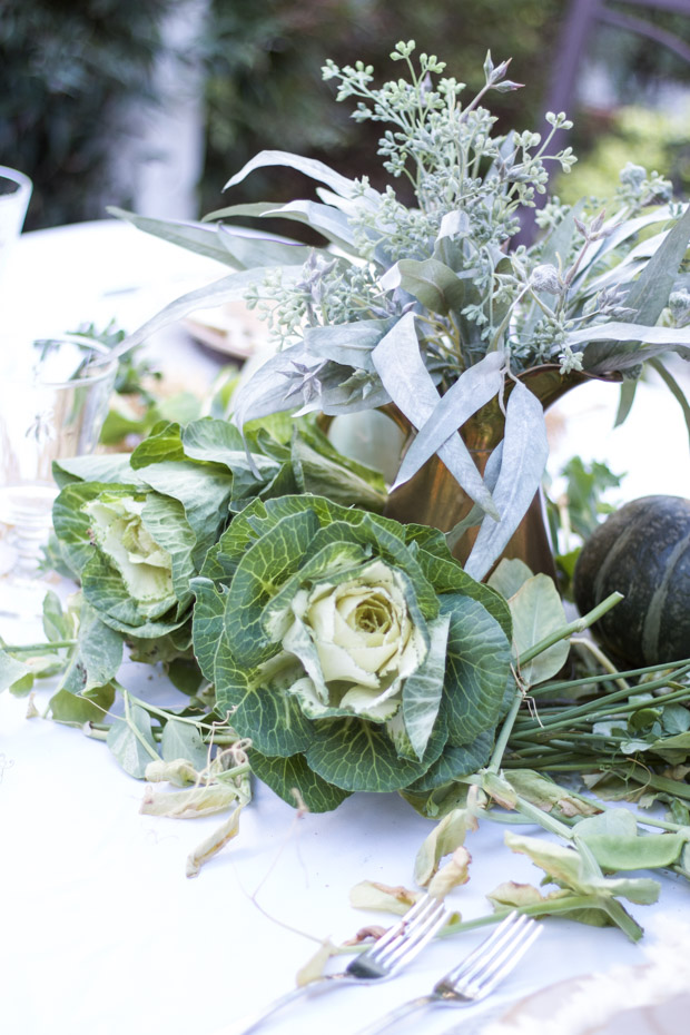 Eucalyptus bouquet with lots of greenery with it on the counter.