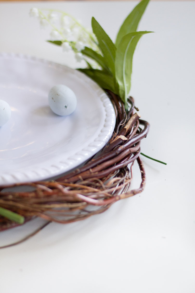 A miniature egg on the white plate on the table.