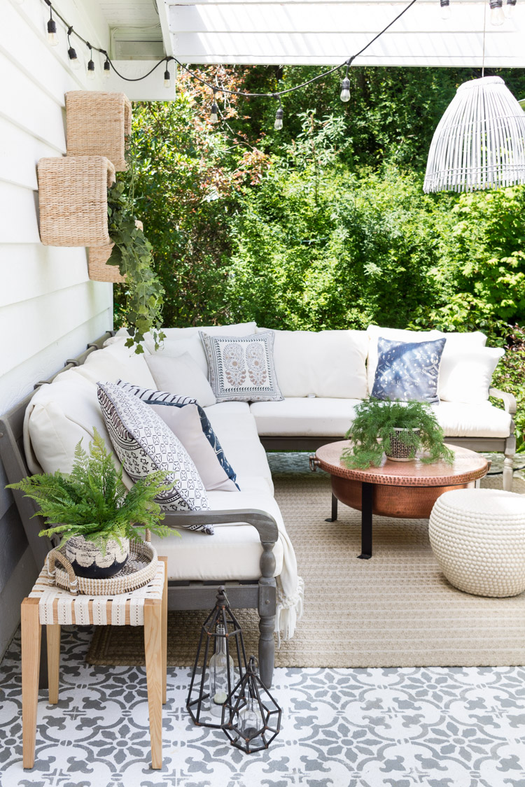 Outdoor DIY - A Boho-Chic Side Table with a rug and couch outdoors.