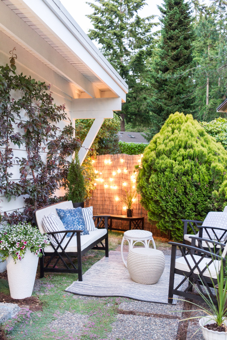 Large green bushes around patio.