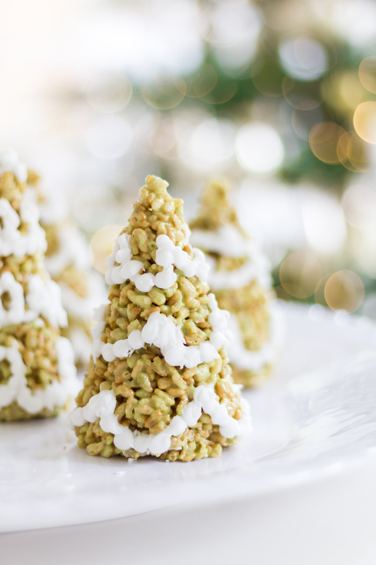 The rice krispie tree with white icing on it.