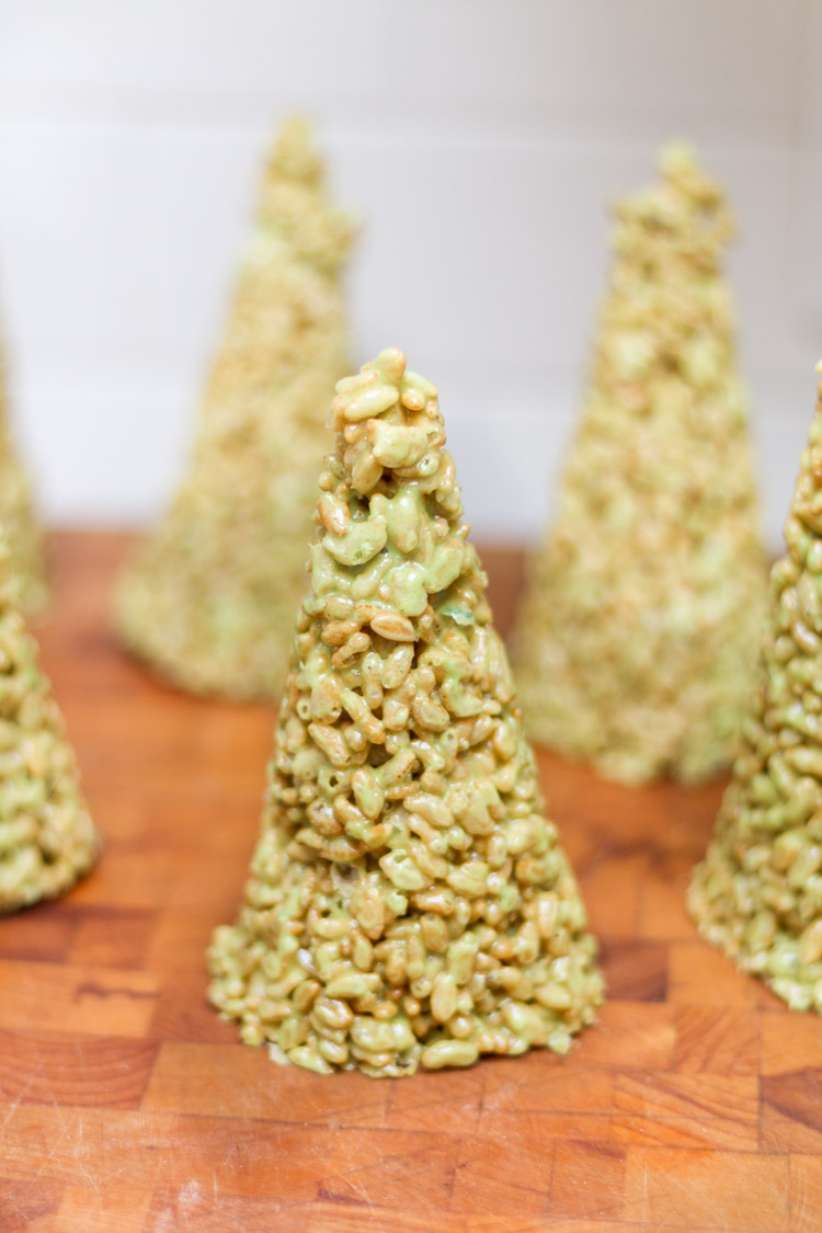 Rice Krispie Christmas trees formed and on the counter.